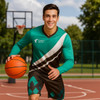 A man in a green and brown sports jersey dribbles a basketball on an outdoor court, with a basketball hoop in the background.