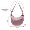 A pink Dumpling Crossbody Bag with an adjustable strap, featuring a zippered pocket and a simple design.