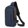 A navy blue anti-theft sling bag with a brown accent, featuring multiple zippers and an adjustable strap.