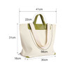A canvas bag with a leather handle, featuring a cream colour and green accents, measured with dimensions visible.
