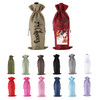 A collection of wine drawstring bags in various colours, including red, green, grey, black, pink, and white, with a logo.