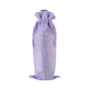 A purple drawstring bag designed for holding a wine bottle, featuring a textured fabric and a tied closure.