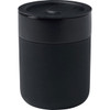 A ceramic tumbler in black, featuring a silicone wrap and a secure lid. It has a sleek, modern design.