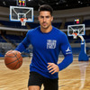 A model in a blue RPET milk silk long-sleeve crew neck shirt holds a basketball on a court. The shirt features a logo.