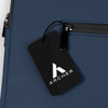 A navy blue soft-touch laptop sleeve featuring a zippered pocket and a branded tag.