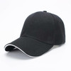 A black cap with a six-panel design and a contrast white trim along the visor, featuring a logo.