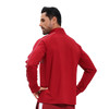 A red polyester spandex raglan jacket features a stand-up collar and quarter-zip design, with a logo present.