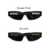 Wraparound sunglasses in black featuring two different print styles on the arms, one in white and one in gold.