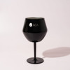A black detachable wine glass with a sleek finish and a logo on the front.