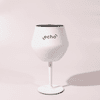 A white Shiraz detachable wine glass with a black interior and a stand, featuring a logo.