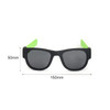 A pair of black sunglasses with green arms, featuring a sleek design and measuring 150mm by 50mm.