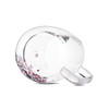 A clear glass mug featuring a double wall design with red and silver glitter inside, and a handle.