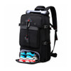 A black convertible backpack duffel bag featuring a compartment for shoes and a roll-up top. It has a logo.