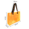 An orange clear tote bag with black handles, featuring measurements of 58cm by 30cm by 10cm.
