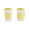 A bamboo fibre coffee cup featuring a white body and a yellow silicone lid, with two different silicone sleeve designs.