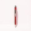 A red ballpoint pen with a silver clip, featuring a sleek design and a shiny finish.