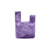 A purple velvet wrist bag featuring a distinctive knot design and has a logo.