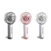 A transparent fan in silver, pink, and clear with a decorative LED light and a logo on the handle.