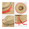 A natural straw hat with a red band and adjustable chin strap, featuring a woven pattern and circular shape.