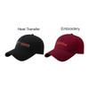Two cotton hard top baseball caps: one black with heat transfer design and one maroon with embroidered text.