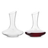 A glass wine decanter with a curved design, showcasing clear glass and rich red wine inside. It has a logo.