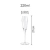A clear tulip champagne glass, measuring 27 cm tall and 4.4 cm wide, with a sleek and elegant design.
