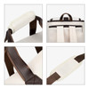 A cream and brown convertible backpack duffel garment bag, featuring padded handles and adjustable straps.