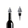 A drink bottle with a silver Christmas tree wine stopper, featuring a sleek metal design and a black rubber seal.