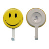 A yellow smiley face button badge with a white hanger, featuring a logo on one side.