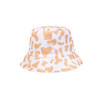 A cow print bucket hat featuring a white base with orange splashes and a circular brim. It has a logo on the side.