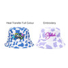 A cow print bucket hat in white and purple, featuring colour and embroidered designs.