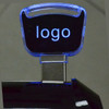 A black Light-on Flash Drive with a transparent blue-lit cap and a logo on the top.