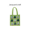 A green knitted tote bag featuring various patterned trees in shades of green and white, with a red accent.