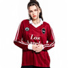 A unisex, retro-style football jersey in burgundy with white accents and a logo. Features long sleeves and a classic collar.
