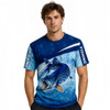 A blue and light blue fishing T-shirt featuring a graphic of a fish, designed with a subtle wave pattern and branding.