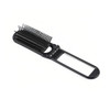 A folding hair brush in black with an integrated mirror. It features fine bristles and a compact design.