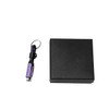 A braided charging cable in purple with a keyring attached, accompanied by a black gift box.