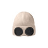 A beige beanie with black goggles attached at the front, featuring a ribbed texture. It has a logo displayed.