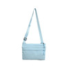 A lightweight crossbody bag in light blue with an adjustable strap and a zippered pocket. It features a logo.