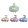 A set of four hair scalp massagers in pastel green, pink, lavender, and blue, each with a handle and pointed bristles.