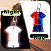 A custom shape reflective keychain designed like a sports uniform, featuring red and blue colours, with a branding logo.