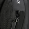 A close-up of a black backpack featuring a zippered pocket and an anti-theft clip.
