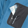 A blue jacket with a black pocket featuring a zip, holding a few notes inside. It has a logo on the pocket.