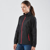 A black rain jacket with a red zip, featuring a high collar and side pockets, displayed on a model.