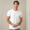 A white men's active sports T-shirt displayed on a male model against a neutral background. The shirt features a logo.