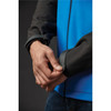 A close-up of a Men's Cascades Softshell jacket featuring a blue body and black sleeves, with a focus on the cuff.