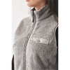 A women's grey Sherpa fleece vest with a zip front and a small pocket, featuring a logo on the chest.