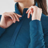 A women's thermal 1/4 zip pullover in deep teal, featuring a textured fabric and a zippered collar.
