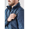 A man adjusts a navy blue Men's Fairbanks 5-in-1 System Jacket, featuring a zipped pocket on the sleeve.