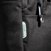 A black backpack featuring multiple compartments and a logo, made from durable material.